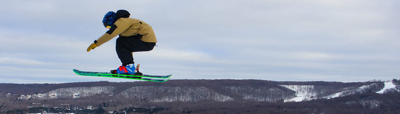Skier going over Funland jumps